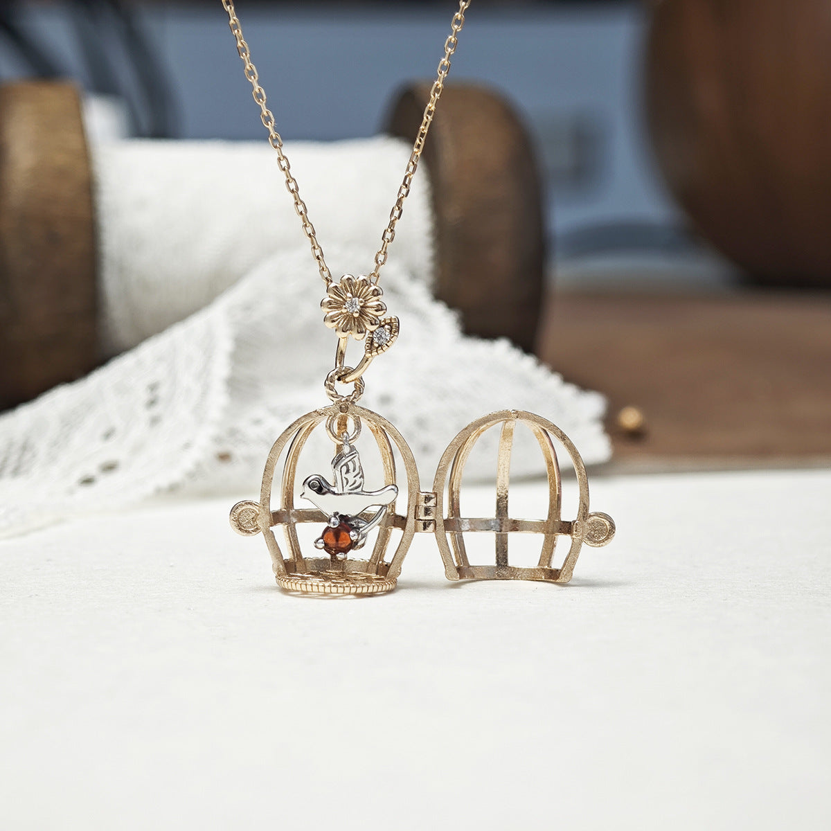 Vintage Style Gold Opening Birdcage Garnet Pendant Necklace, Two-Tone Bird and Floral Bail Charm